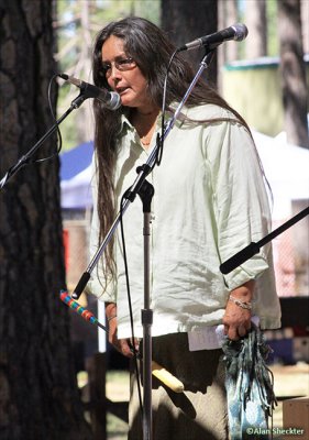 Singer with Loping Wolf native flute and drum group, Oak Tree Stage