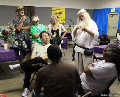 Magician Prof. Merloch Silvermaine entertains Ziggy Marley's band and festival directors