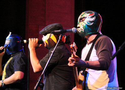 Opening song: Masked men Ulises Bella (from left), Asdru Sierra, Raul Pacheco