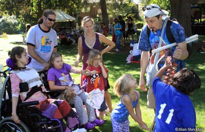 Whipple (top right) entertains a bunch of kids