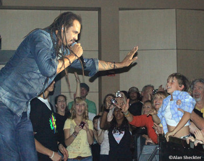 Michael Franti, ready to high-five a young one