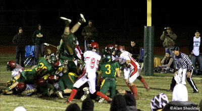 RB Jordan Dobrich (feet in the air) scores one of his three touchdowns