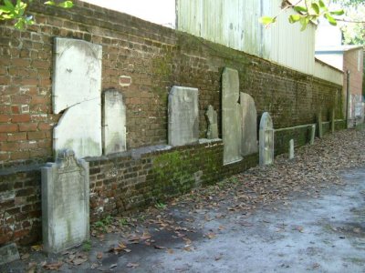 At the cemetery, where camping soldiers knocked over headstones, they were mounted on the walls
