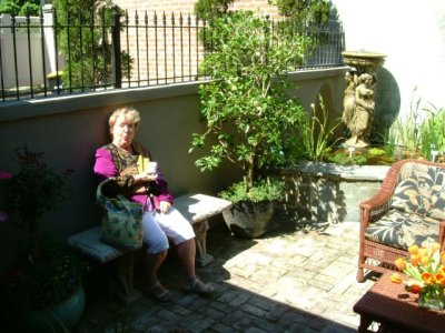 Kathy enjoying the garden seat