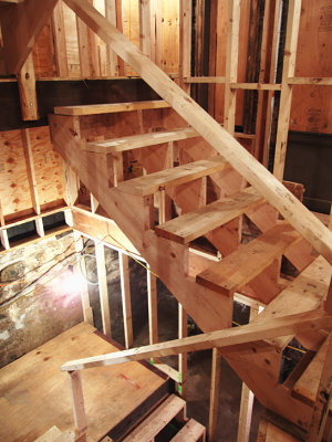Stairs to basement and second floor are in place