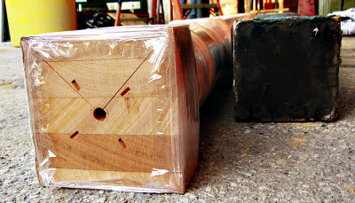 The new post is a lamination of 5 heavy mahogany boards.
