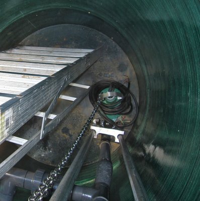 Looking down in the sump: Ladder, pump, chain & track to lower the pump