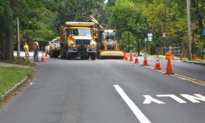 The next day, the street is blocked to connect to the main sewer line.