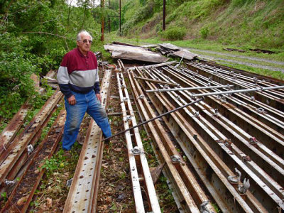 Harry Olson salvages steel for his part of the trail