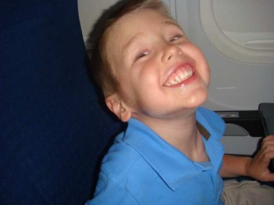 on the airplane, flying to nana's