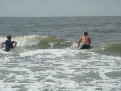 hank and jeff play in the waves