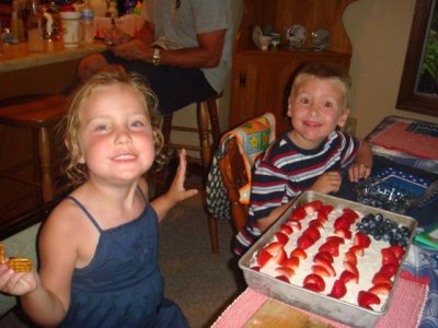 the kids decorate the flag cake