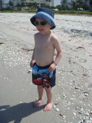 cutie pie didn't want to wear his second bathing suit- loves his cars bathing suit