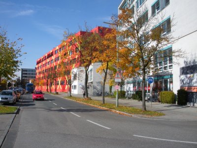 A brightly painted studio building near Siemens