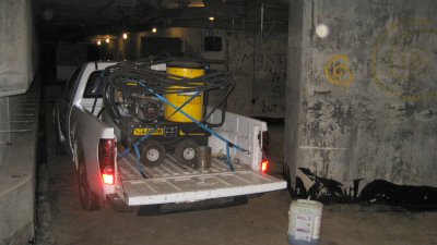 Graffiti cleaning truck with hot water blasting rig parked in main corridor