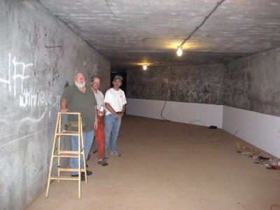 Mess hall interior re-lit. Left right, Volunteers Sam Stokes, Morgan Ford and Greg Jennings.