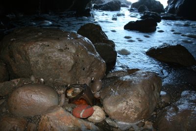 Rocks on floor of sea cave. Note the parking meter.