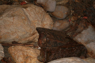 Unidentified metal on floor of cave