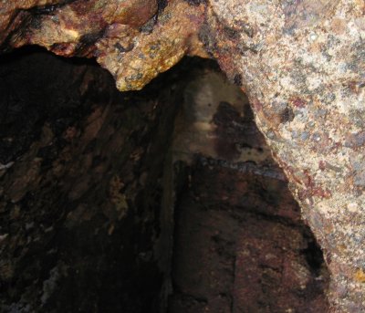 Door set into cliff on north side of point. John Hall had to reach around cliff one-handed to get this photo.