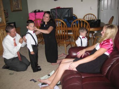Jeremy & Jen fix Ethan's suspenders, with Boston & Kylee before reception