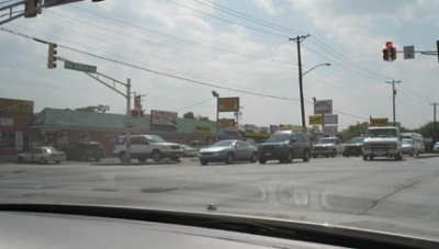 Fort Worth strip mall has it all: donuts, liquor, pistol range, nail salon, tires, tattoos, taqueria an ATM and Kool Stuff!