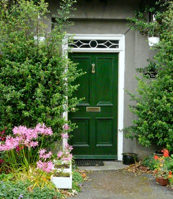 ...and finds an elegant green door, in the little gate lodge