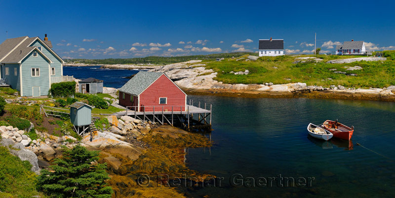 Houses in the quiet fishing village of Peggys Cove Nova Scotia in full sun