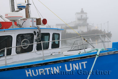 Blue boat in fog at Fishermans Cove Eastern Passage Halifax Nova Scotia