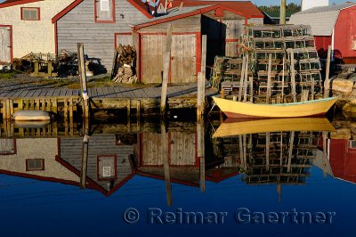 Quiet yellow and brown boat at Fishermans Cove Eastern Passage Halifax Nova Scotia