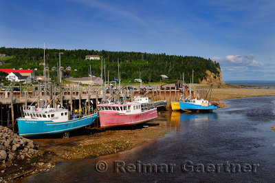 Upper Salmon River and fishing boats at low tide on the Bay of Fundy at Alma New Brunswick