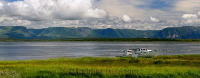 Panorama of abandoned boats at Parsons Pond Newfoundland with Gros Morne Long Range Mountains