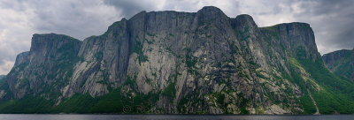 Panorama of steep rock cliffs of fjords on Western Brook Pond at Gros Morne National Park Newfoundland