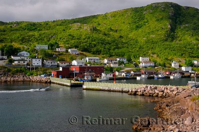 Motorboat entering breakwater at Petty Harbour-Maddox Cove Avalon Peninsula Newfoundland