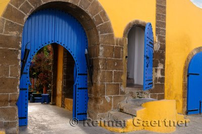 Colorful blue doors on a yellow building in Casablanca Morocco