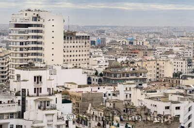 Zoomed view of the white hazy Casablanca cityscape with clouds