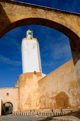 Minaret of the Grand Mosque Old Portuguese city El Jadida Morocco through an archway