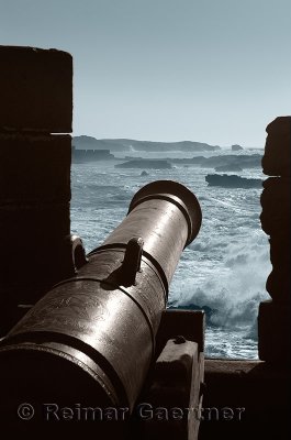 Two toned image of a cannon on the Essaouira ramparts facing the Atlantic ocean coast