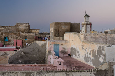 Soft pastel pink and blue at dawn over rooftops of Essaouira Morocco