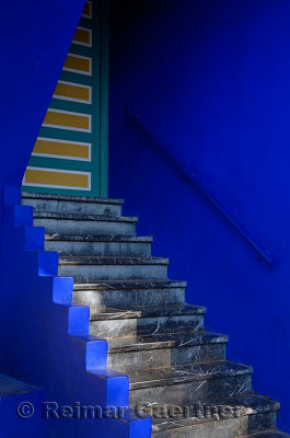 Stairs and door at the cobalt blue Islamic Art Museum of Marrakech at Majorelle Garden Morocco