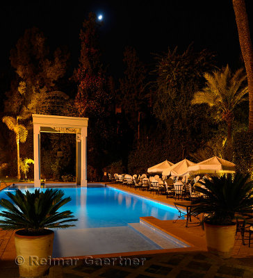 Moonrise over the swimming pool at Tichka Salam resort in Marrakech Morocco