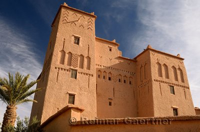 Refurbished historic Kasbah Ait Ben Moro with Palm and Olive tree at Skoura Morocco
