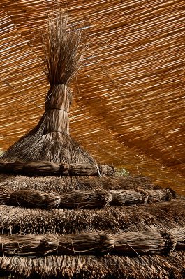 Abstract of straw umbrella and bamboo roof inside Kasbah Amerhidil in the Skoura oasis Morocco