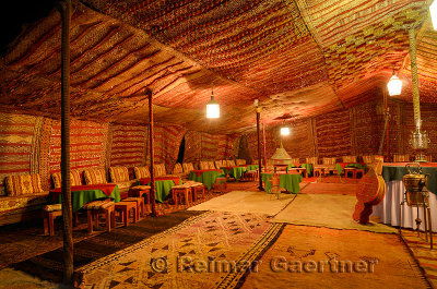 Large empty carpeted Berber tent at night in Tinerhir Morocco