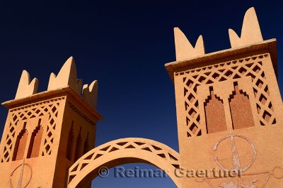 Traditional Berber pise towers made of red adobe and blue sky at resort in Dades Valley