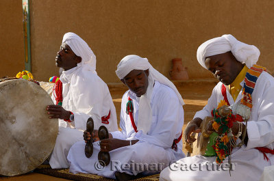 Eyes closed Gnawa musicians in trance with tbel hajhuj and krakeb in Khemliya Morocco