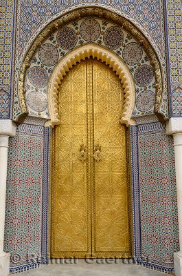Brass door to the Dar El Makhzen Royal Palace with intricate Zellige tilework in Fes el Jadid Morocco