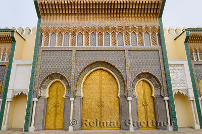Brass doors to the Dar El Makhzen the Kings Royal Palace with intricate Zellige tilework in Fes Morocco