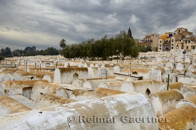 Large Jewish cemetery in the Mellah of Fes el Jedid Morocco with storm clouds
