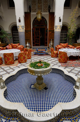 Fountain and dining area in Moorish style at Riad El Yacout in Fes el Bali Morocco