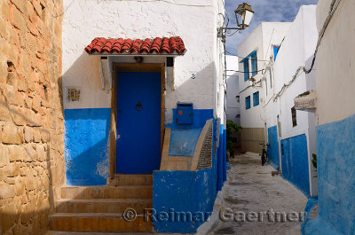 Blue door windows and walls of alley in Oudaia Kasbah Rabat Morocco
